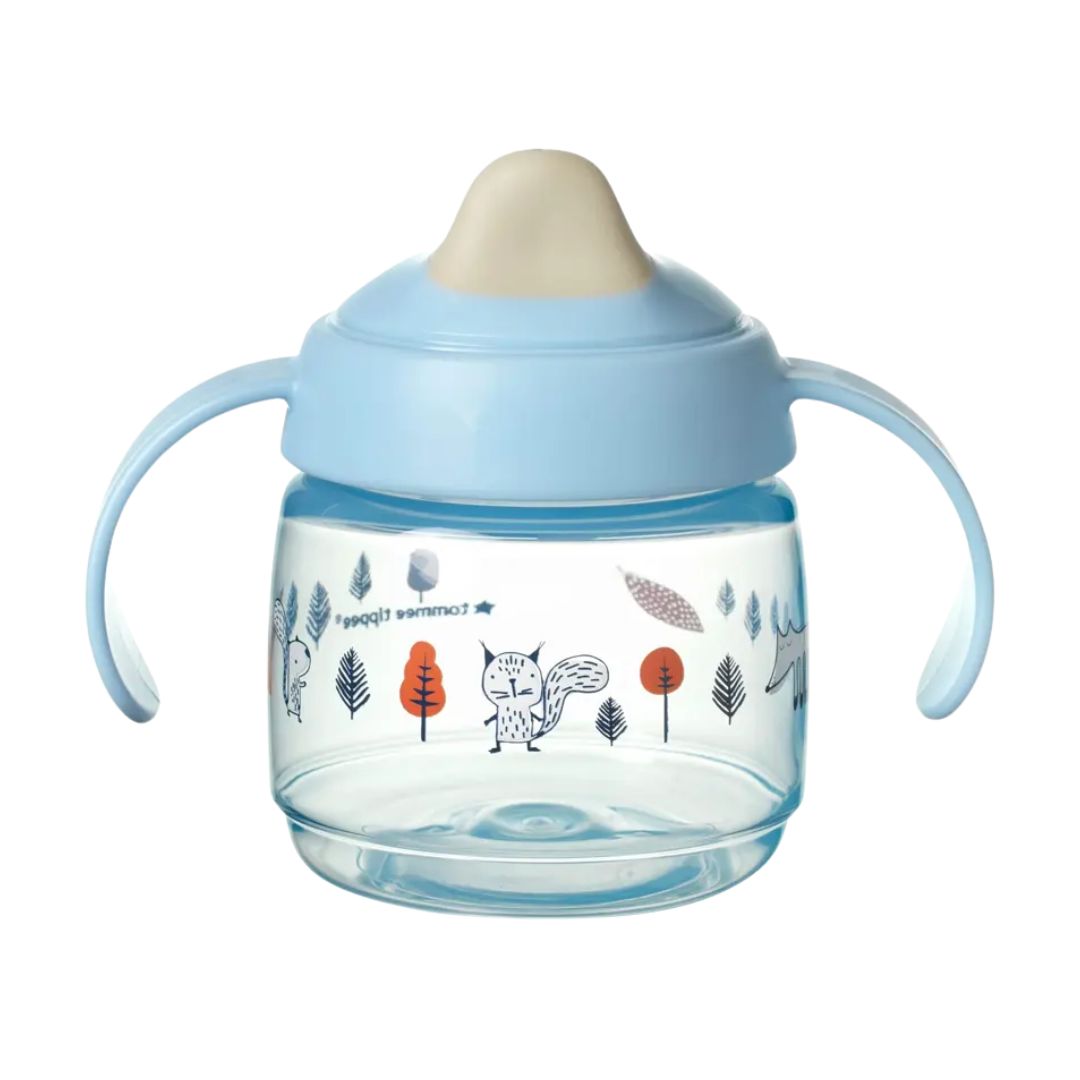 Children's Tommee tippee sippy cup with blue lid and handle on a white background
