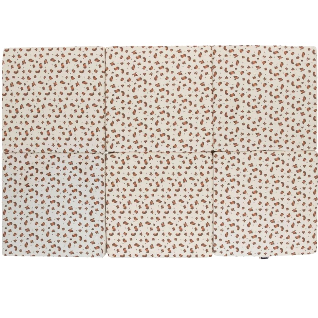 Candide Foldable play mat with a subtle pattern on a white background