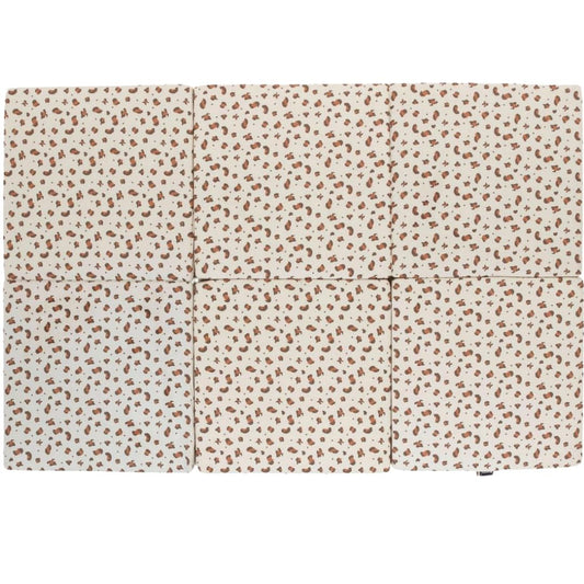 Candide Foldable play mat with a subtle pattern on a white background