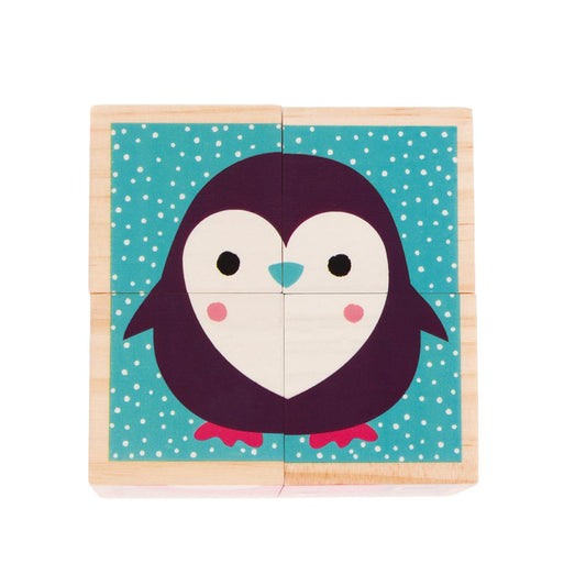 Wooden puzzle with a penguin design on a teal background with white polka dots
