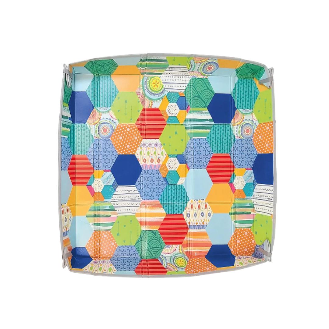 Colorful geometric patterned Infantino Play mat cover on a white background