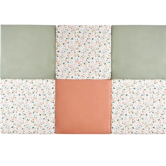 Candide playmat in green, white with small pattern, and terracotta on a white background