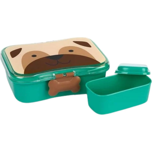 A green plastic Skip Hop lunch box with a dog face printed on the lid, shown next to its separate green lid on a white background.