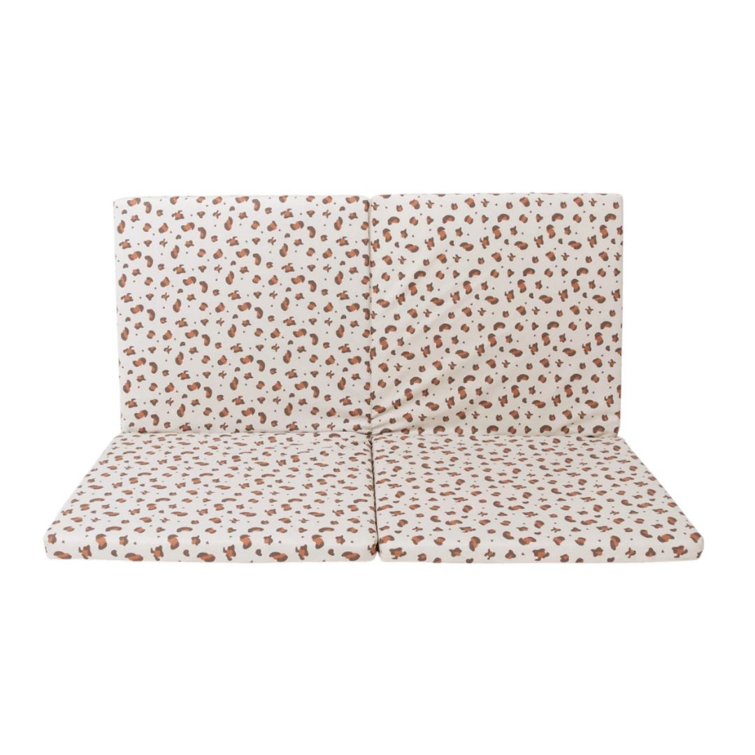 Candide Play mat, Patterned cushion on a white background