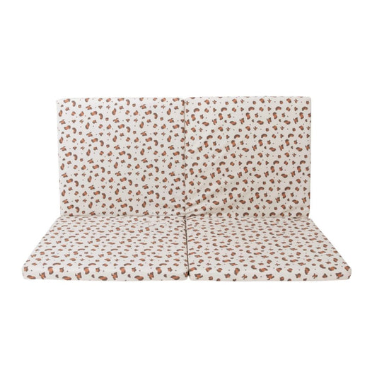 Candide Play mat, Patterned cushion on a white background