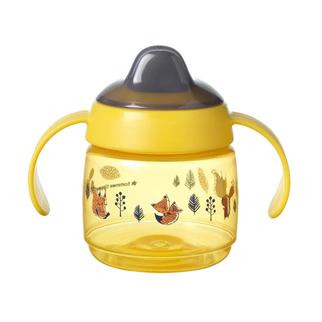 Yellow Tommee tippee sippy cup with animal illustrations on a white background