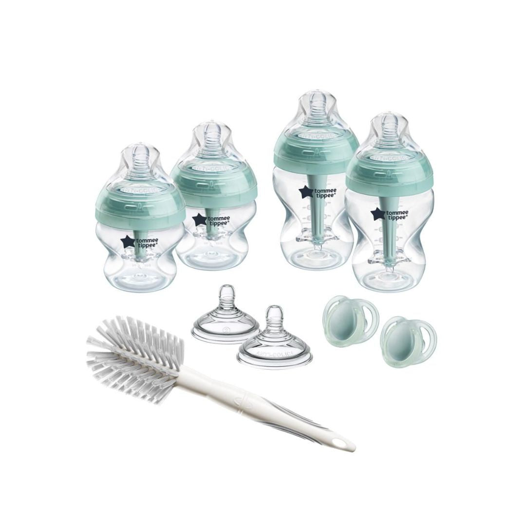Set of Tommee Tippee baby bottles and accessories on a white background