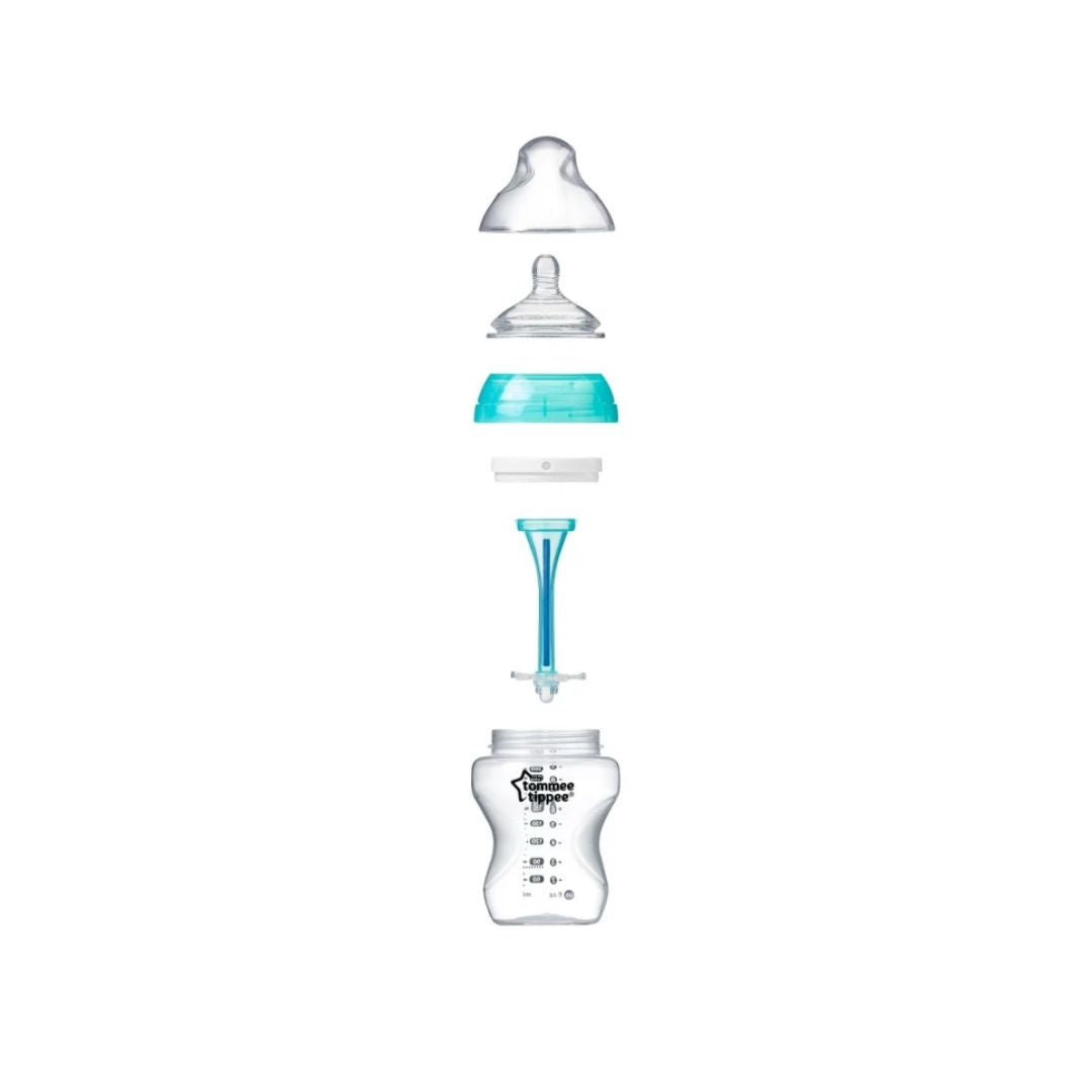 Baby bottle with components on a white background