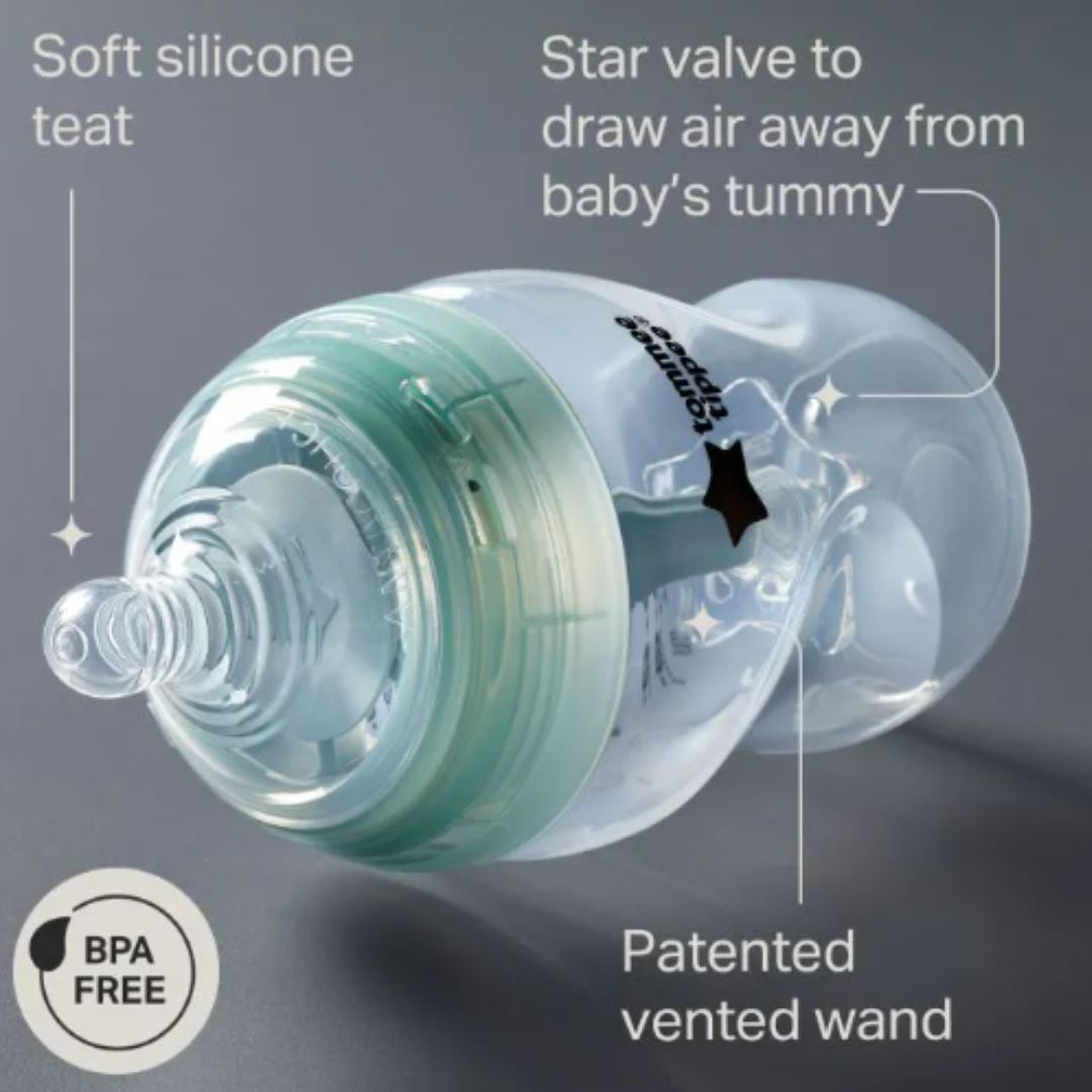 Baby bottle with labeled features on a gray background