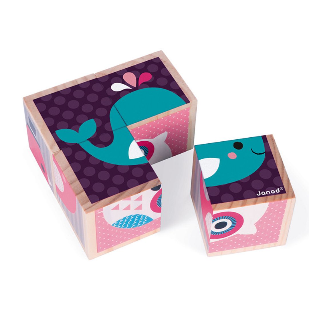 Wooden blocks with whale design on a white background