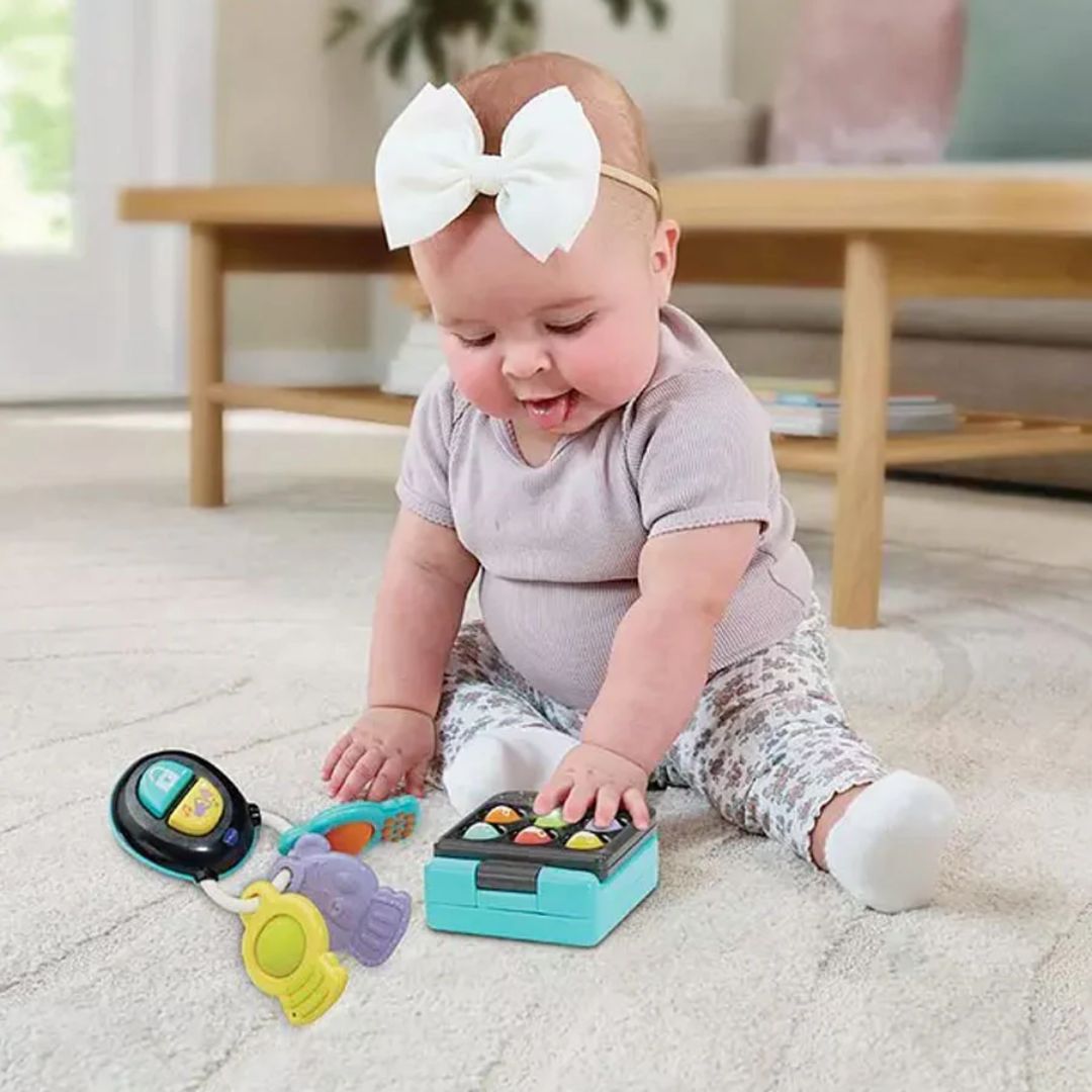 Baby playing with colorful toys on a carpeted floor