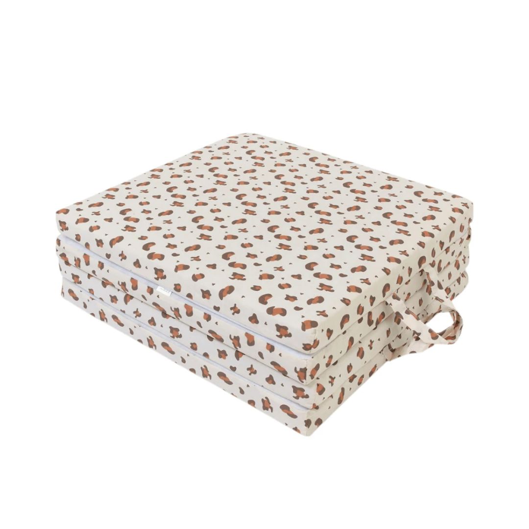Candide Folded Play mat  with brown leopard print on a white background