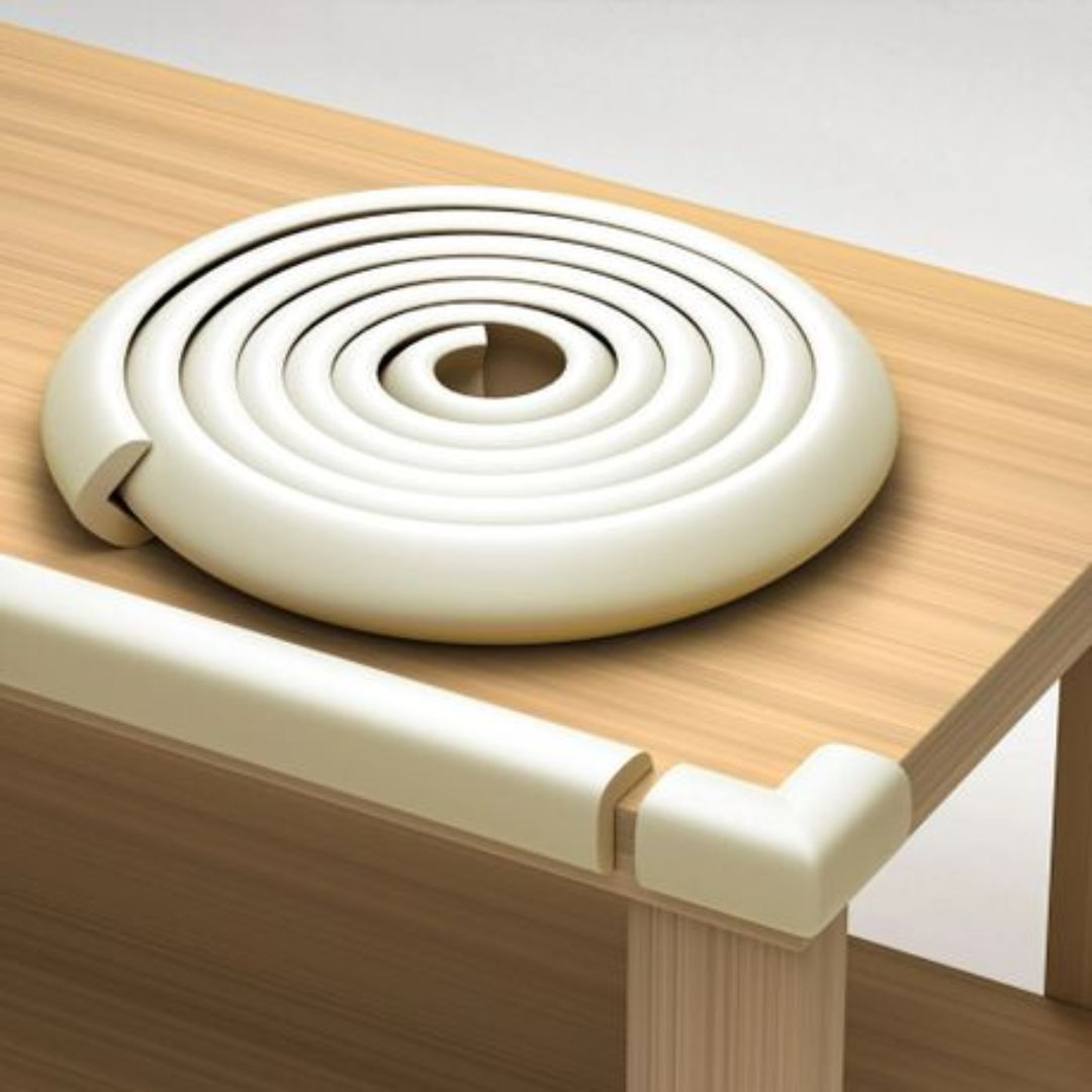 Round beige corner protector on a wooden surface