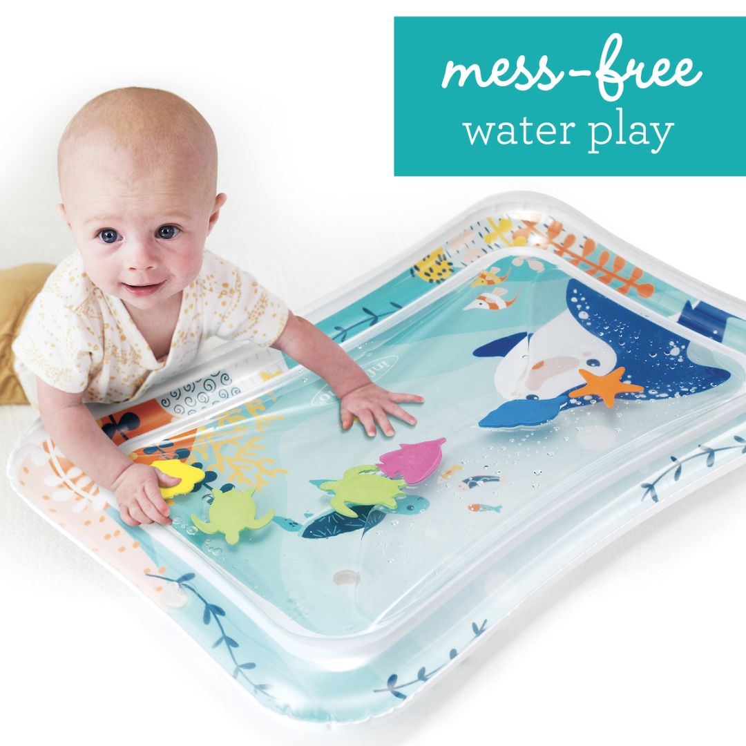 Baby playing with a mess-free water play mat featuring sea animals.