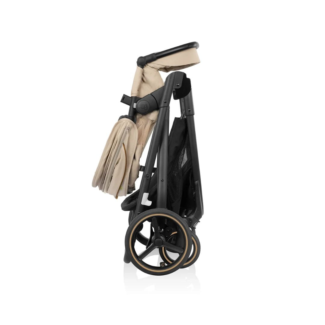 Foldable Evenflo  stroller with beige cover on a white background