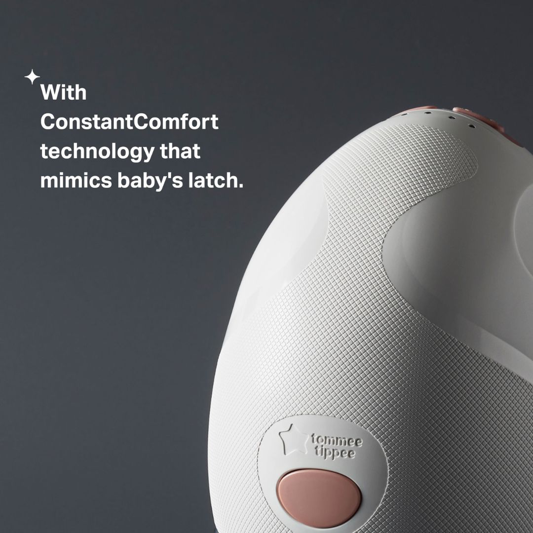White Breast Pump with pink button and 'Tommee Tippee' branding on a dark background.