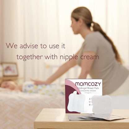 Woman lying on a bed with a box of momcozy breast pads in the foreground.