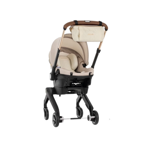Evenflo Beige baby stroller with canopy on a white background