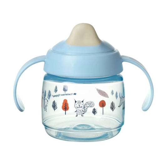 Children's Tommee tippee sippy cup with blue lid and handle on a white background