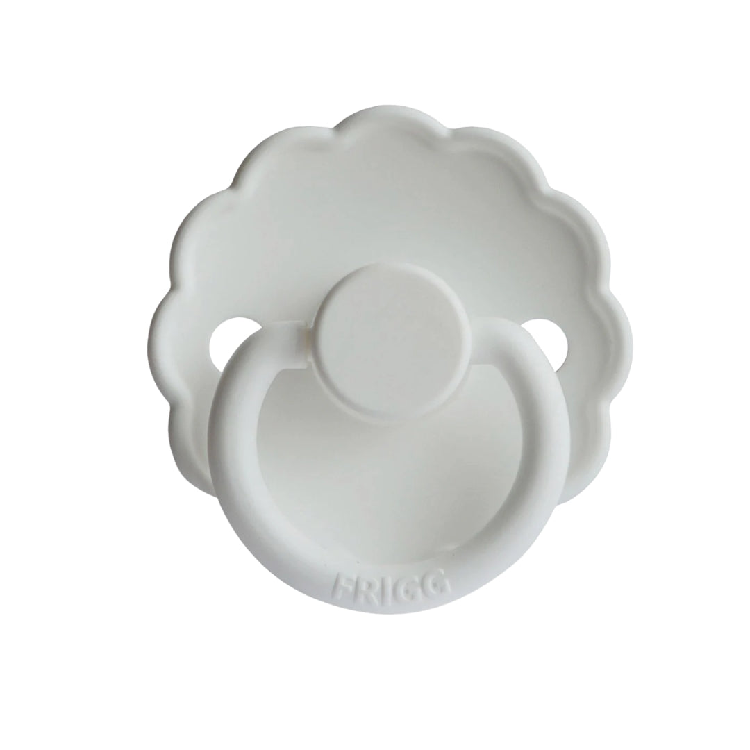 White baby pacifier with Frigg branding on a white background