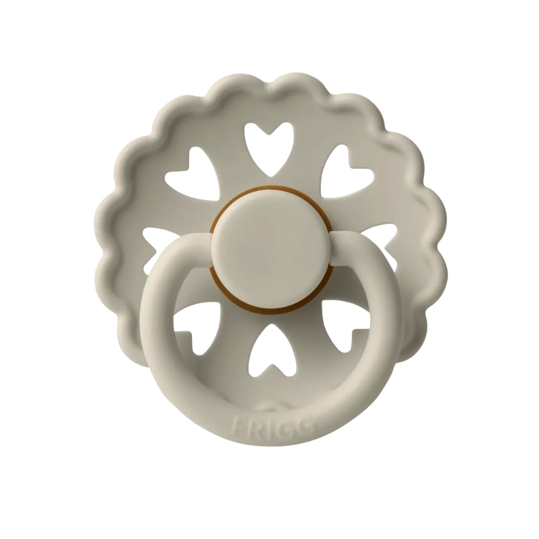 Frigg Decorative ceramic Pacifier with heart designs on a white background