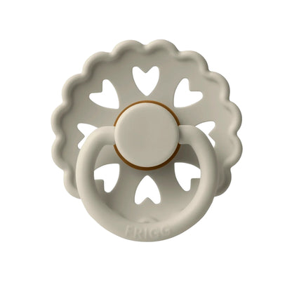 Frigg Decorative ceramic Pacifier with heart designs on a white background