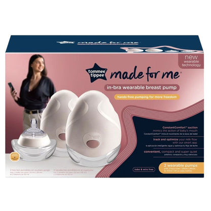 Tommee Tippee in-bra wearable breast pump packaging with a woman using a phone in the background.
