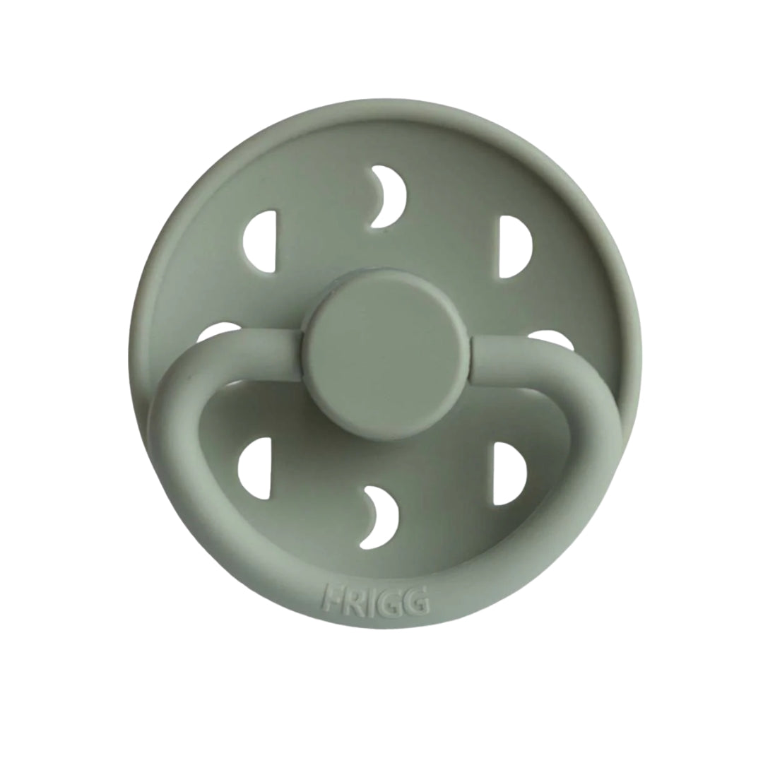 Sage green pacifier with 'Frigg' branding on a white background