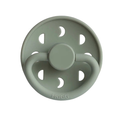 Sage green pacifier with 'Frigg' branding on a white background