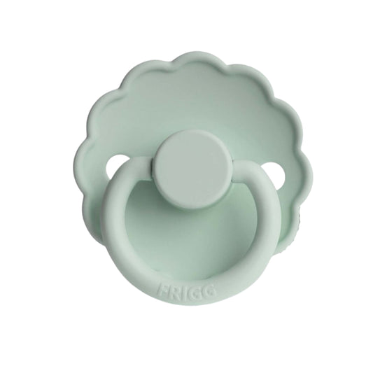 Mint green Frigg pacifier with floral design on a white background