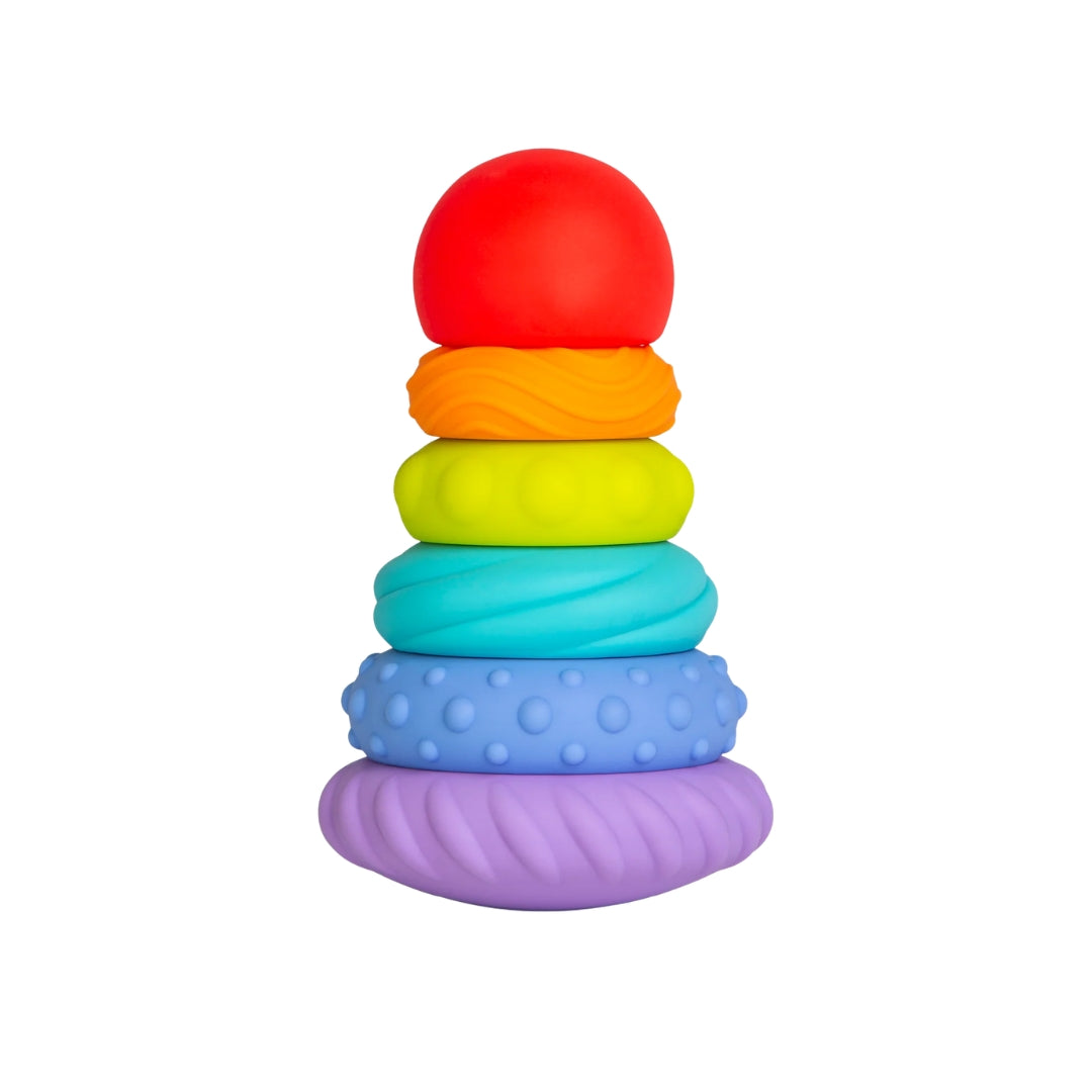 Ubbi Stack of colorful silicone rings on a white background