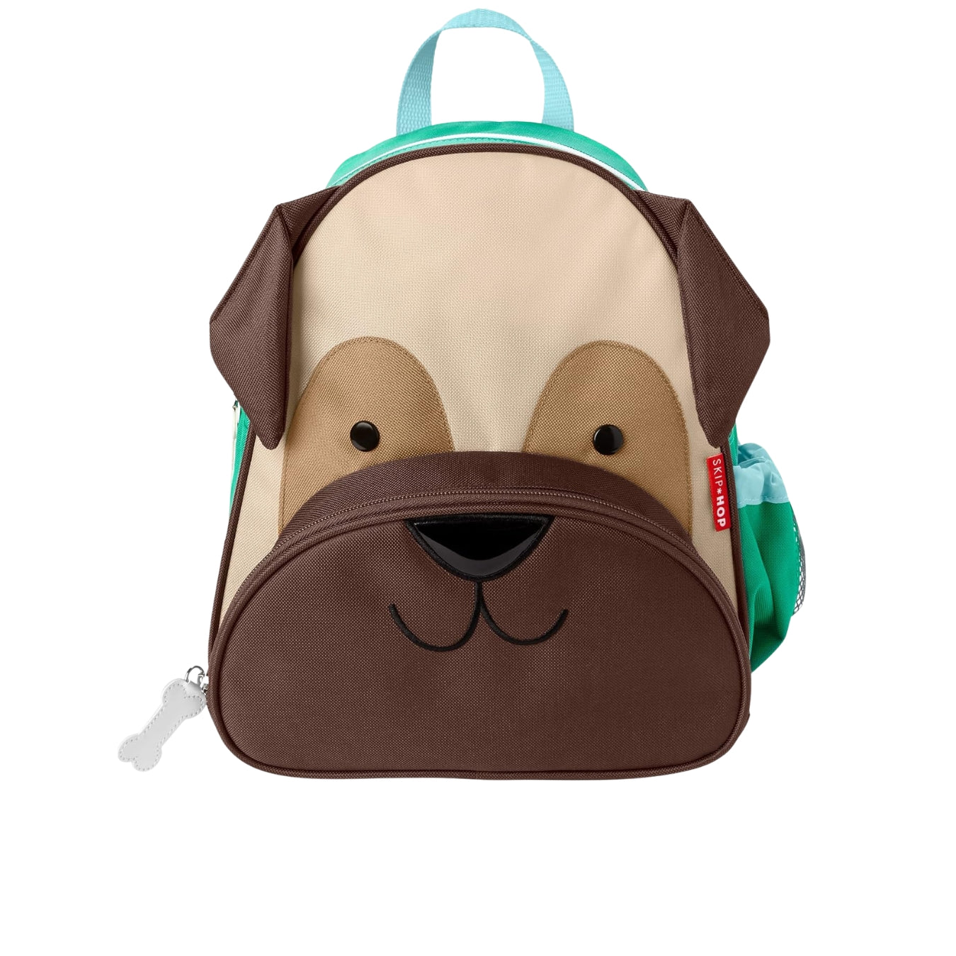 A Skip Hop dog-shaped backpack with a beige and brown dog face design, featuring a front zipper pocket, a turquoise top handle, and side pockets.