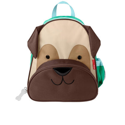 A Skip Hop dog-shaped backpack with a beige and brown dog face design, featuring a front zipper pocket, a turquoise top handle, and side pockets.