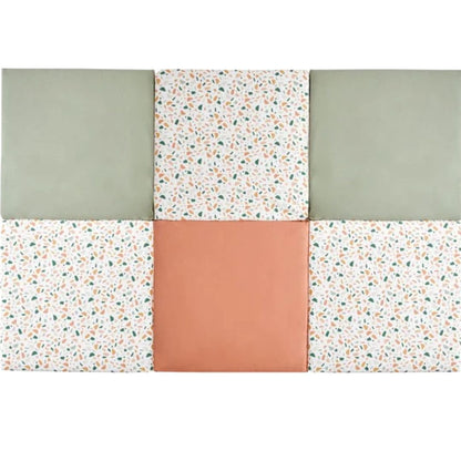 Candide playmat in green, white with small pattern, and terracotta on a white background