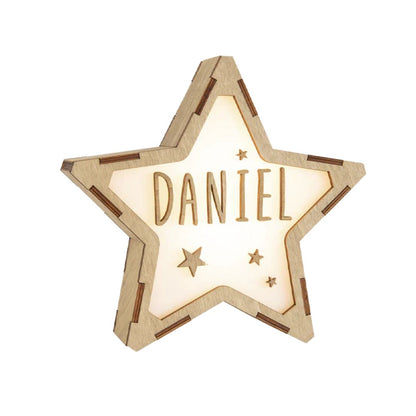 Star-shaped light with 'DANIEL' engraved on a white background