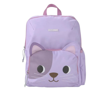 A light purple Skip Hop backpack featuring a cute cartoon cat face design on the front pocket, with pink accents and a top handle, shown against a plain white background.