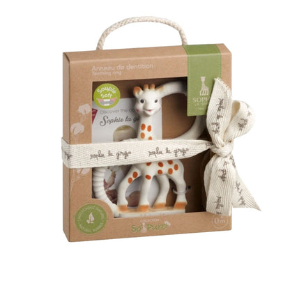Sophie la Girafe teething ring in retail packaging, a soft giraffe-shaped natural rubber teether, labeled for newborns 0 months and up.