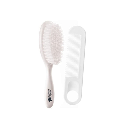 White comb and brush set on a white background