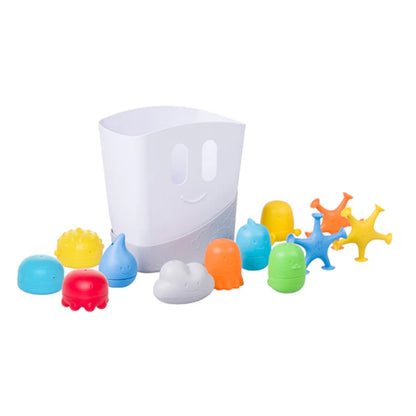 Colorful bath toys with a transparent cup on a white background