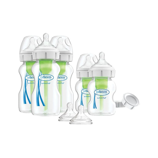 Set of Dr. Brown's baby bottles with accessories on a white background