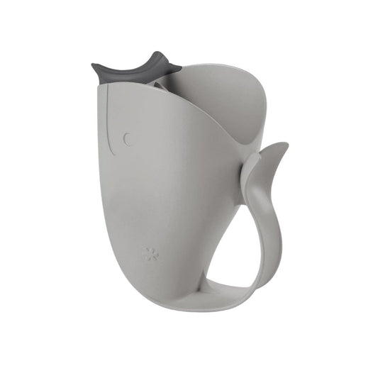 Skip Hop Grey whale-shaped bath rinser cup with a yellow tail fin handle and spout, designed for rinsing a baby's hair during bath time, shown on a white background.