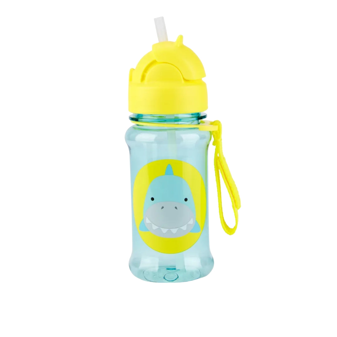 A kids' Skip Hop water bottle with a translucent light blue body, a bright yellow lid and strap, and a cartoon shark graphic on the front, shown on a plain white background.