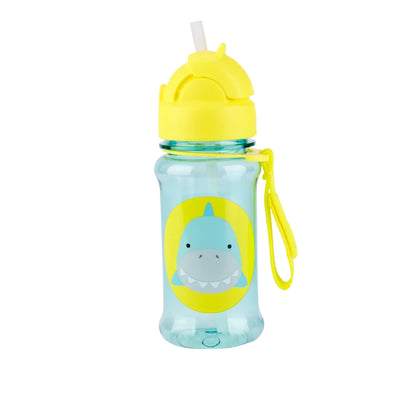 A kids' Skip Hop water bottle with a translucent light blue body, a bright yellow lid and strap, and a cartoon shark graphic on the front, shown on a plain white background.
