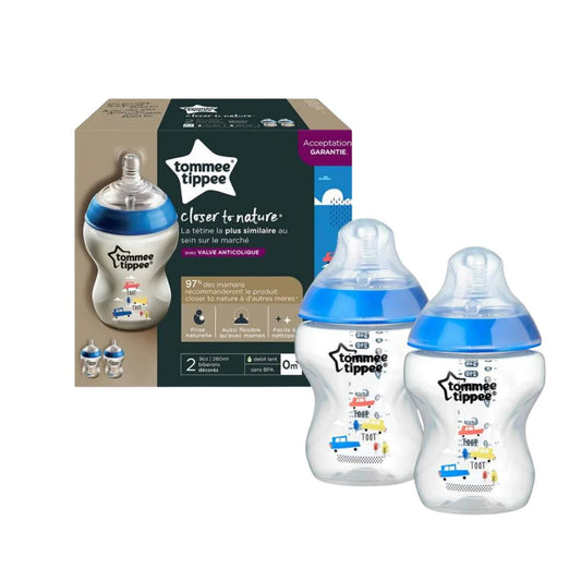 Tommee Tippee baby bottles with packaging on a white background