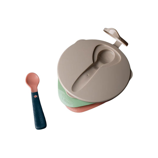Children's Tommee Tippee bowl with a lid and spoon on a white background