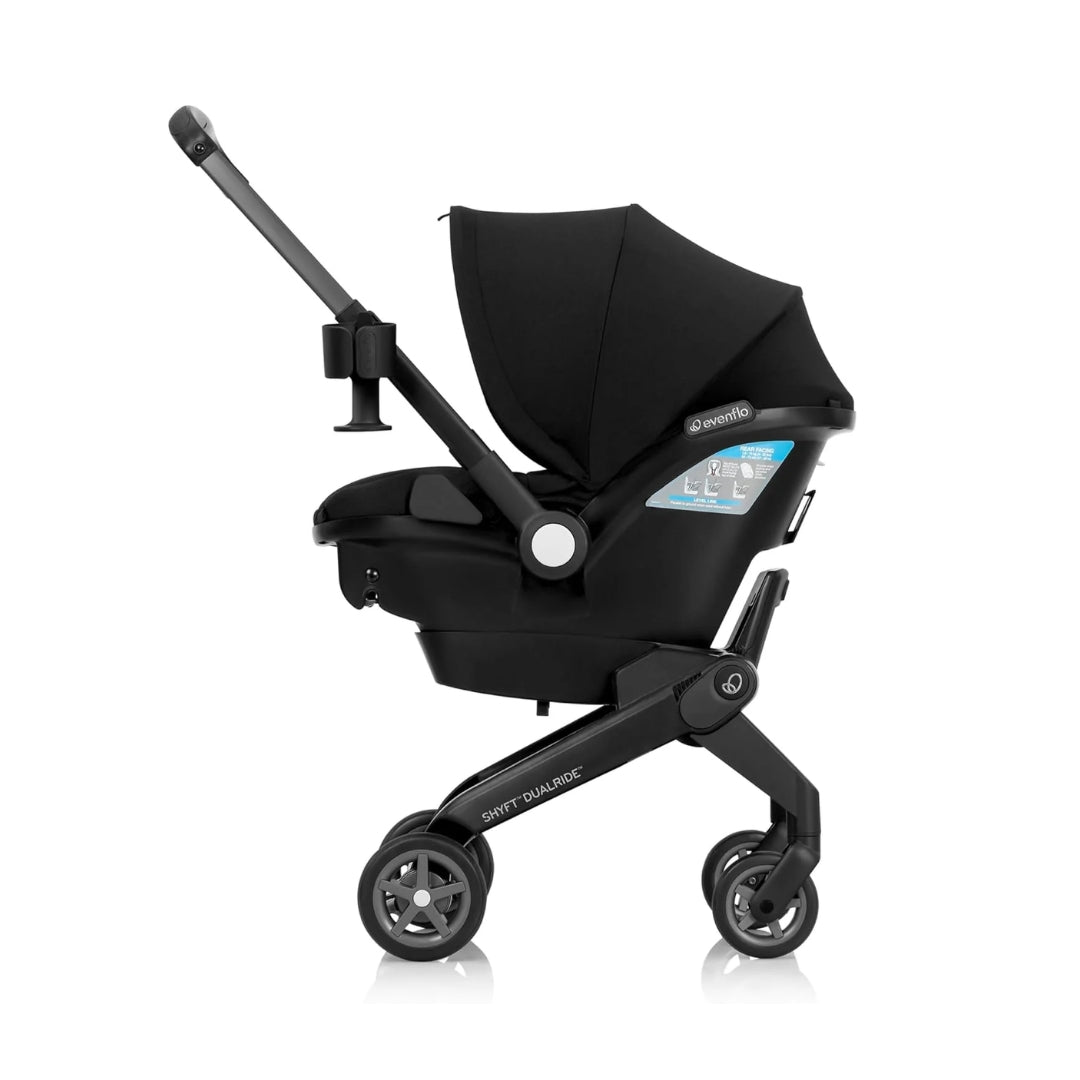 Evenflo Black stroller with canopy on a white background