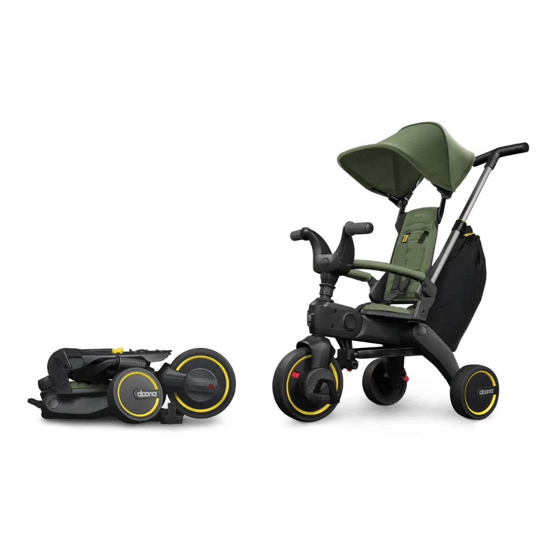Doona Green and black children's tricycle with detachable seat on a white background