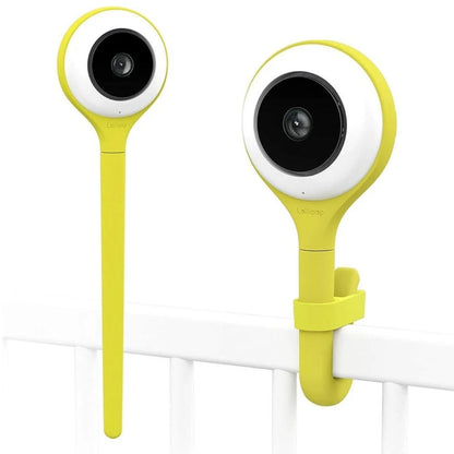 lollipop yellow and white baby monitor devices attached to a white crib rail.