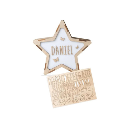 Star-shaped wooden nameplate with 'DANIEL' and a set of letters on a white background
