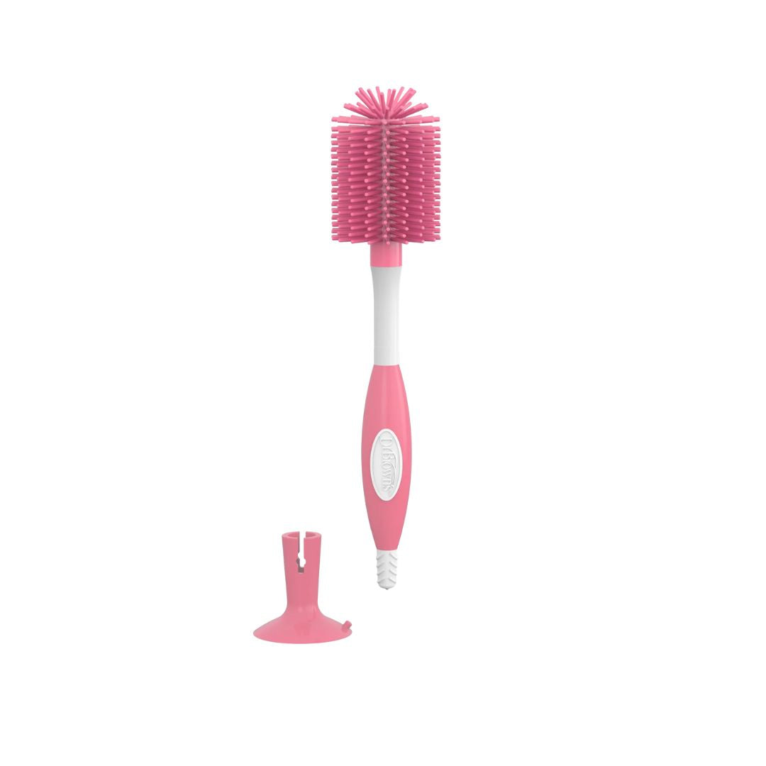 Dr Brown's  Pink bottle brush with a white handle on a white background